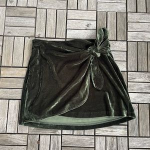 Green velvet mini skirt.